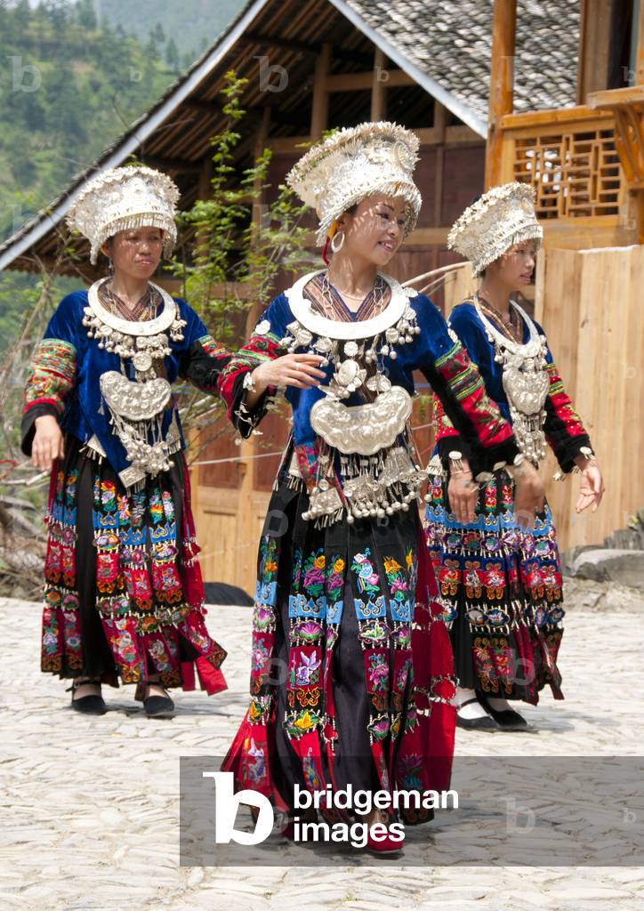 China: Miao women dancing in the village of Langde Shang, southeast of Kaili, Guizhou Province