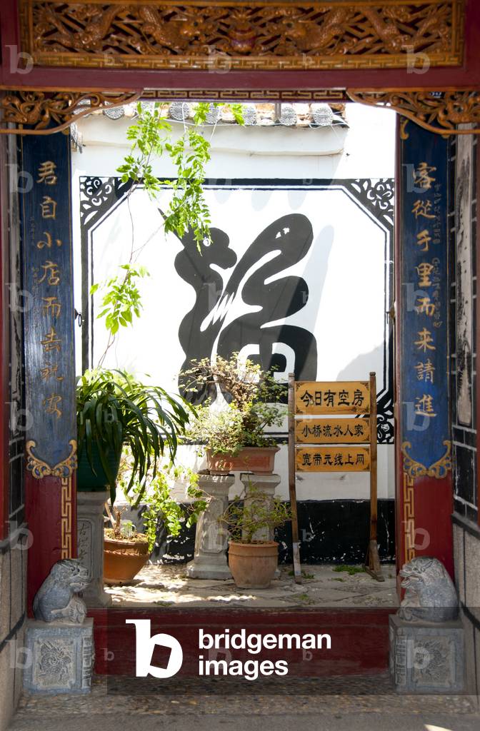 China: Naxi house entrance, Lijiang Old Town, Yunnan Province
