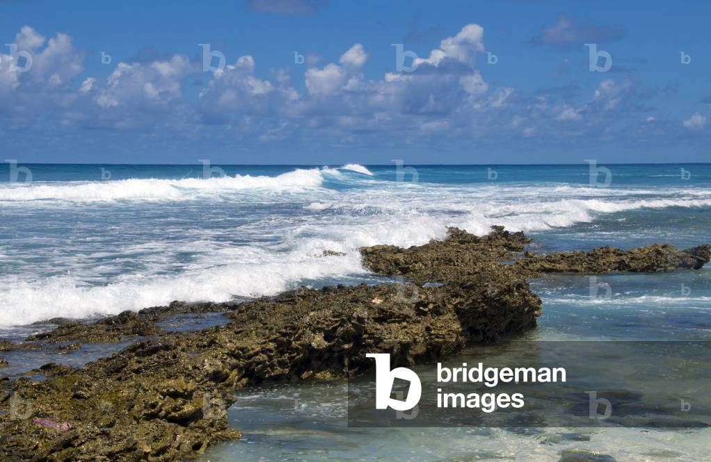 Maldives: Waves break on the coral reef which is very close to the island at this point, Hithadhoo Island, Addu Atoll (Seenu Atoll)
