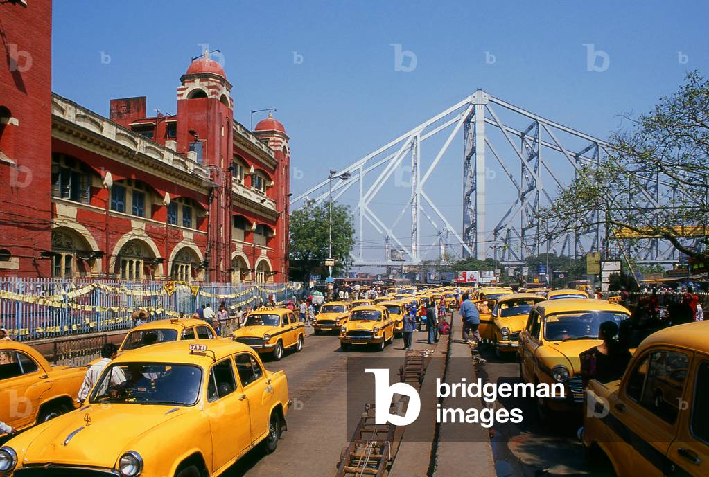 India: Taxis await custom near the Howrah Bridge and Howrah Railway Station, Kolkata (Calcutta), West Bengal