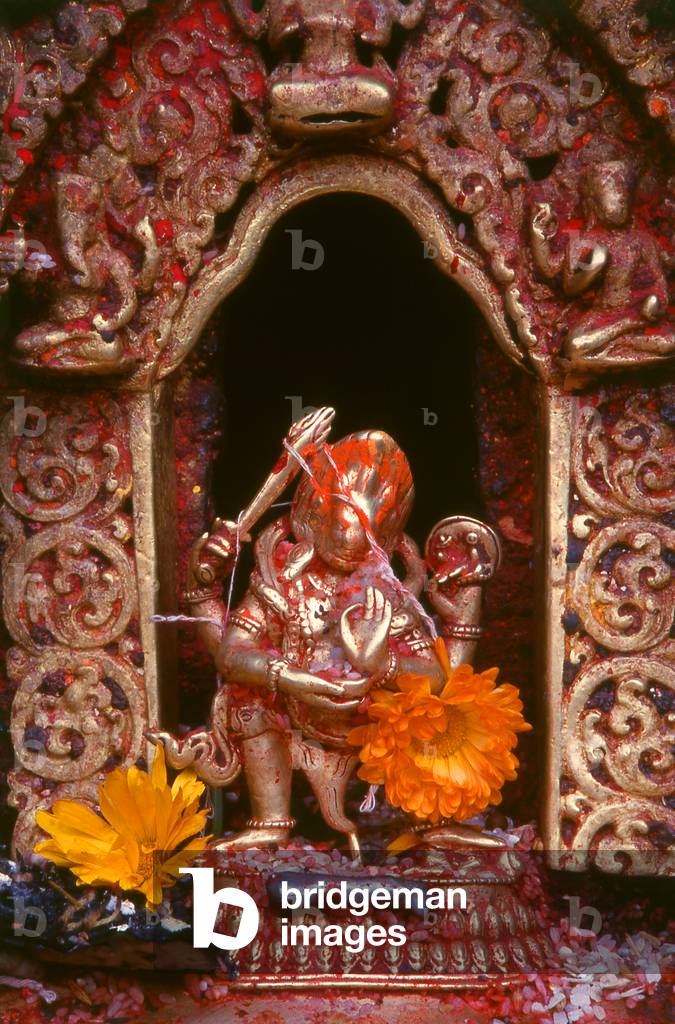 Nepal: Small metal statue of the Hindu god Shiva in a roadside shrine in Kathmandu, Kathmandu Valley