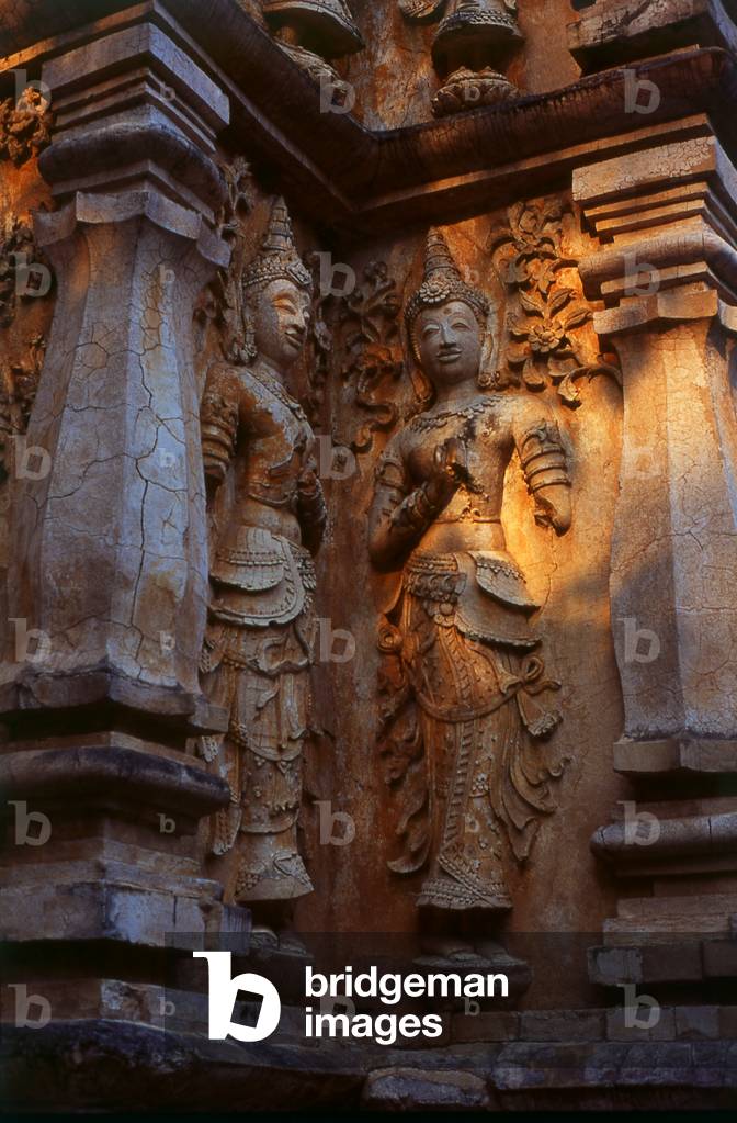 Thailand: Stucco thewada (angels) adorn the Maha Chedi (Great Chedi), Wat Chet Yot (Seven Spires), Chiang Mai, northern Thailand