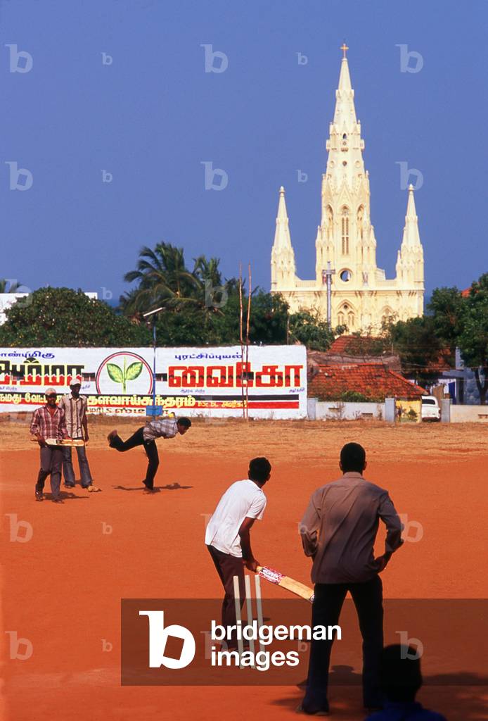 India: Cricket match at Kanyakumari with the Our Lady of Ransom Catholic Church in the background, Tamil Nadu