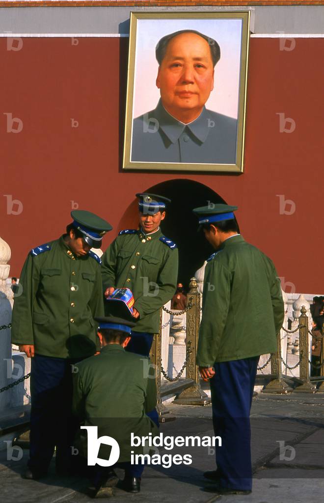 China: Military visitors in front of Chairman Mao's portrait at the Gate of Heavenly Peace (Tiananmen), Beijing