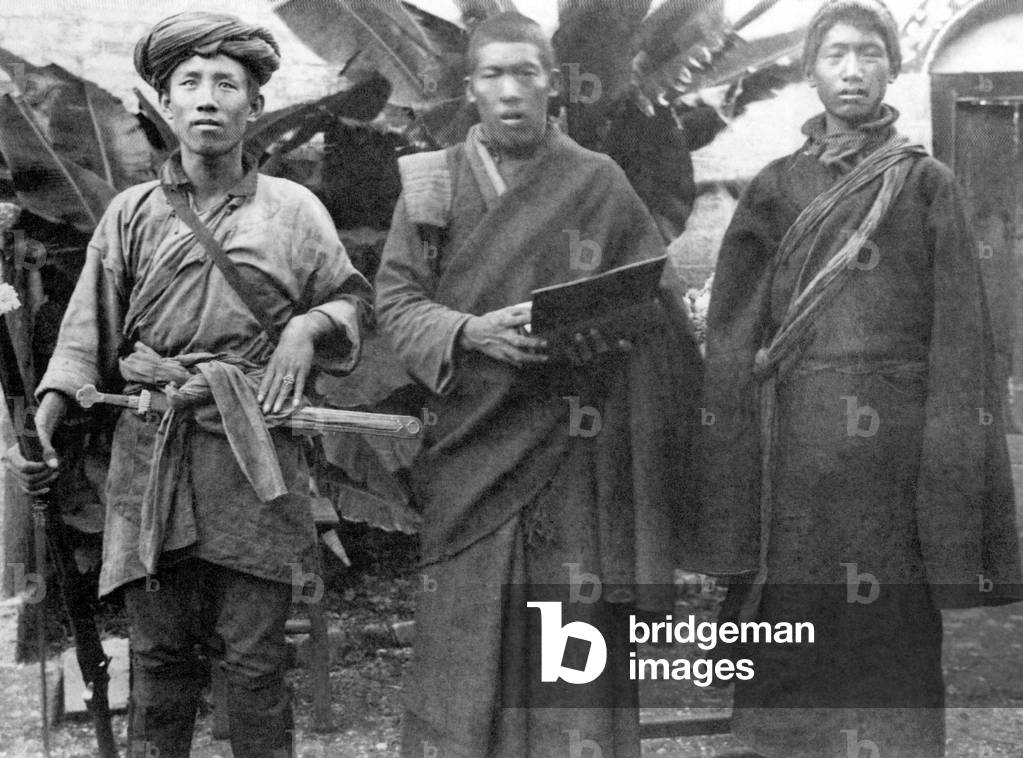 Tibet/ China: (From left to right:) A soldier, a Buddhist monk and a peasant stand for a photograph in Tibet in 1920.