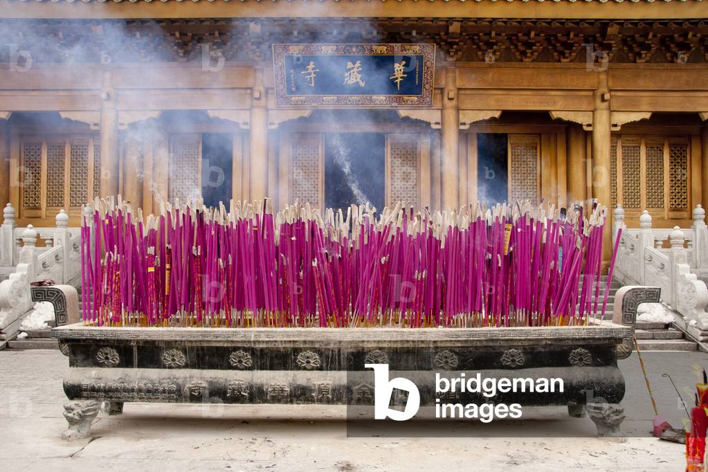 China: Incense burns in front of the Huazang Temple at the Golden Summit (Jin Ding), Emeishan (Mount Emei), Sichuan Province