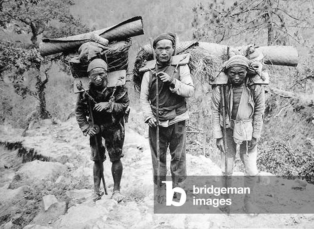 China: Bai nationality porters near Lijiang, Yunnan Province, 1923.