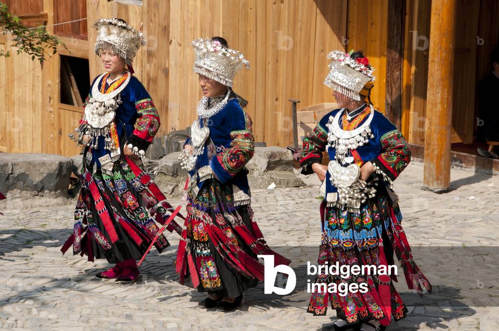 China: Miao women dancing in the village of Langde Shang, southeast of Kaili, Guizhou Province