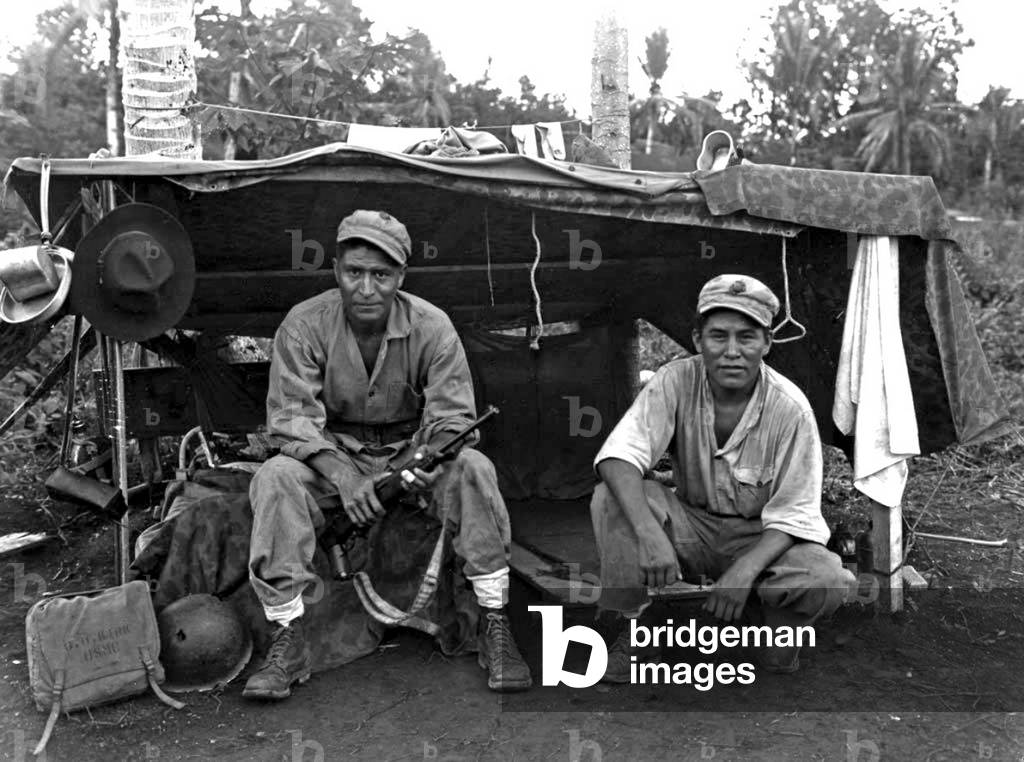 USA / Guam: 'Code Talker' U.S. Marines George H. Kirk (left) of Ganado, Arizona and John V. Goodluck (right) of Lukachukai, Arizona, both of the Navajo Nation, are photographed before their shelter on a hillside following the American victory of the Battl (photo)