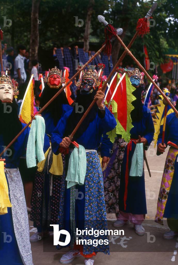 China: Miao mask performance at a festival near Huangguoshu, Guizhou Province