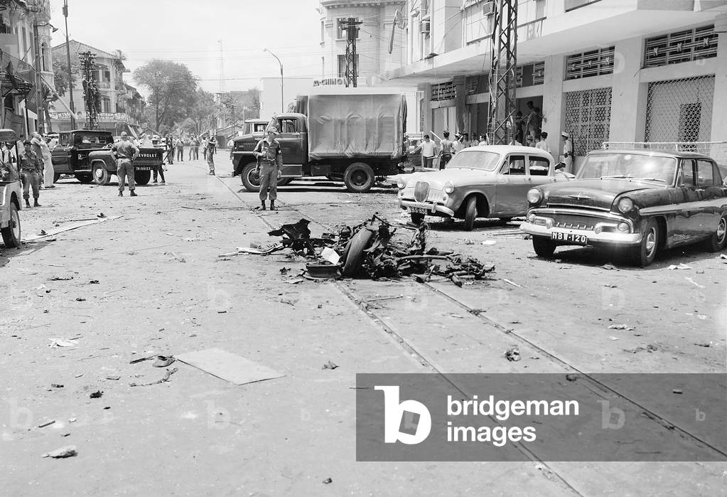 Vietnam: Aftermath of a street bombing attributed to the NLF (Viet Cong) in Saigon, c. 1965.