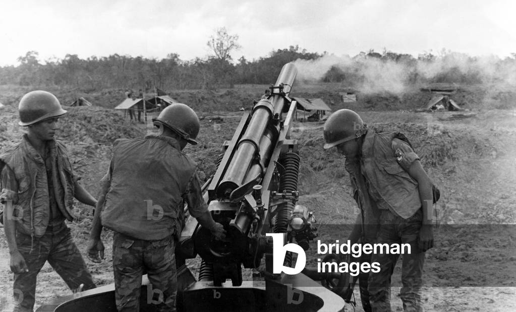 Vietnam: Army of the Republic of Vietnam (ARVN) troops firing an M102 howitzer, 1968