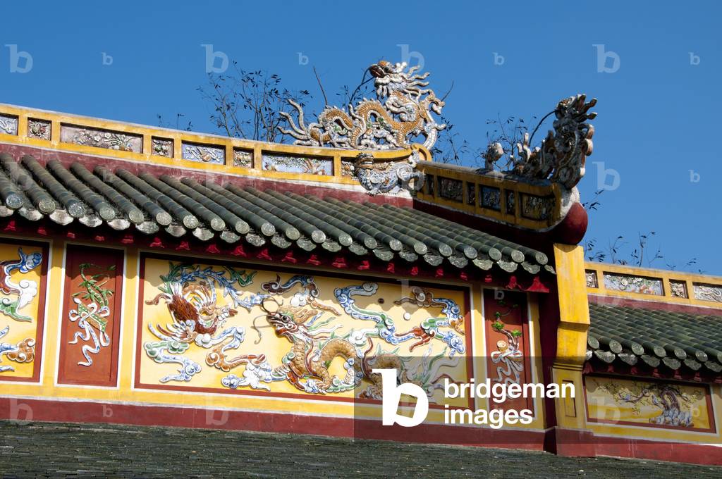 Vietnam: Dragon details on a roof in the Imperial City, The Citadel, Hue