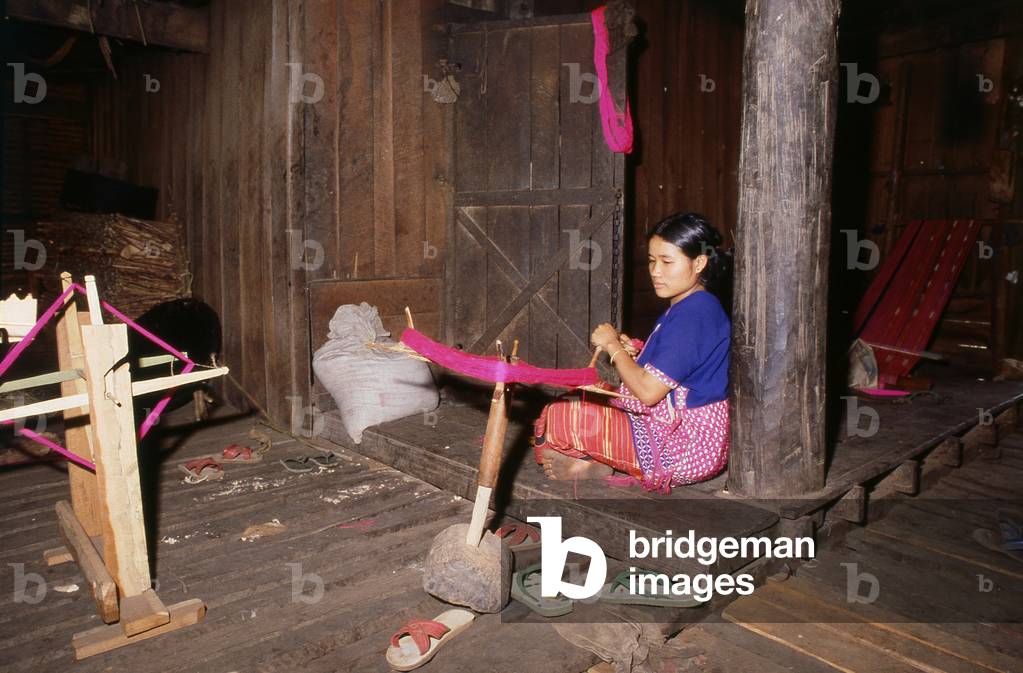 Thailand: Karen woman spinning yarn for weaving, near Mae Sariang, Mae Hong Son Province, northern Thailand