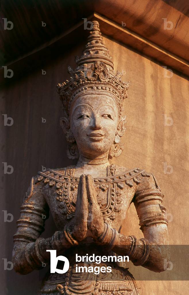 Thailand: Sculpture of thewada (angel) on the Ho Trai or library building, Wat Phra Singh, Chiang Mai, Northern Thailand