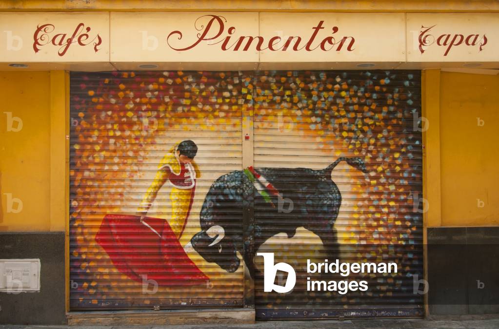 Spain: Bullfighting mural on a closed cafe grille, near the Real Maestranza bullring in Seville