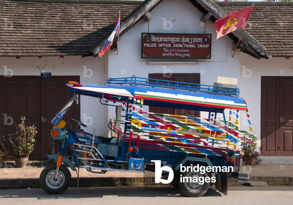 Laos: A jamboh (jumbo) parked outside the police office on Sisavangvong Road, Luang Prabang