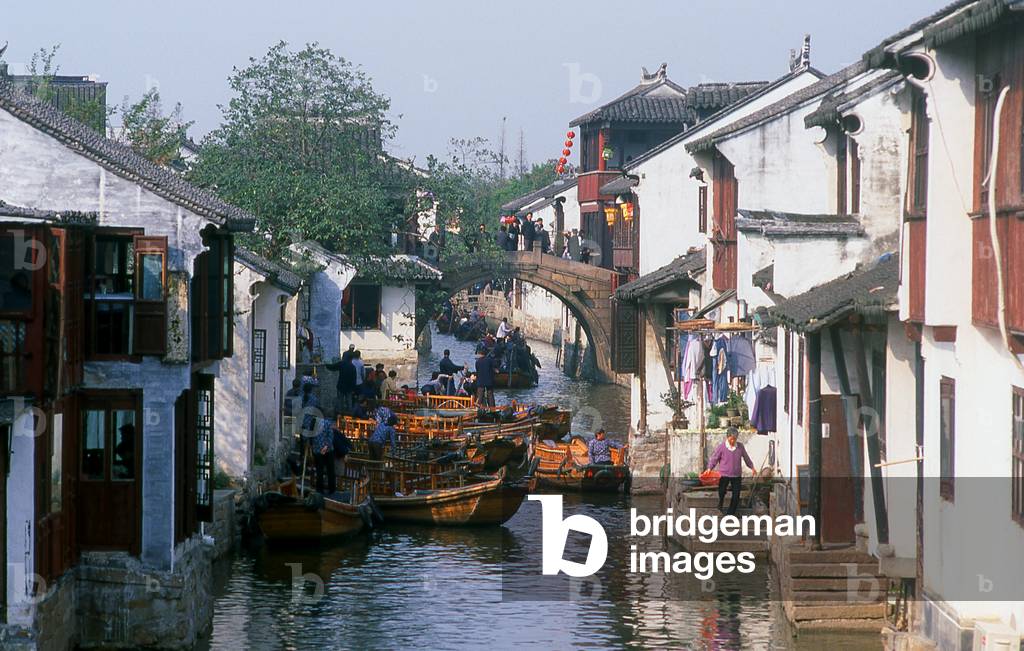 China: Boats and bridge on a canal in the 'Water Town' of Zhouzhuang, Jiangsu Province