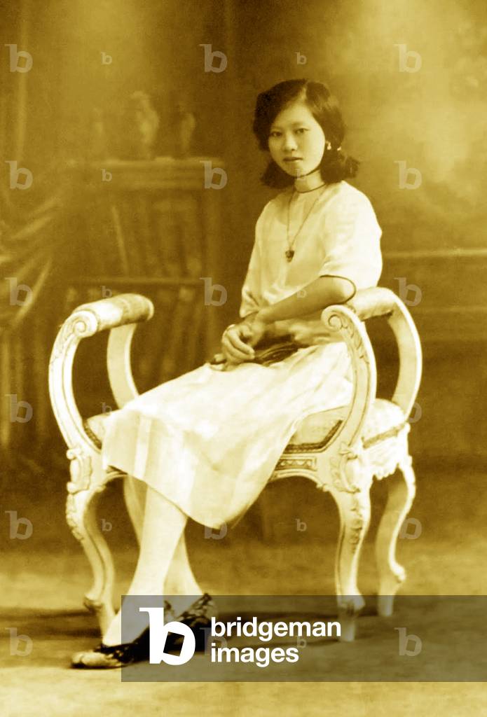 Singapore / Malaysia: Studio Portrait of a fashionable young Nyonya (Peranakan Chinese) woman in Western dress, 1930s