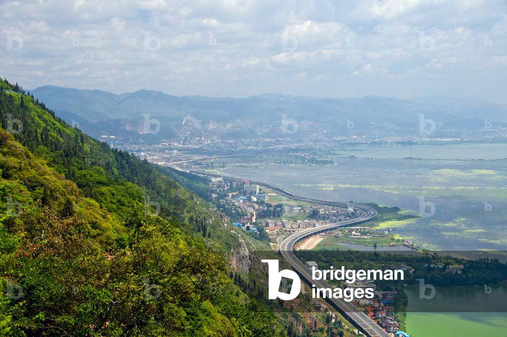 China: Highway leading to Kunming seen from Long Men (Dragon Gate), Xishan (Western Hills), near Kunming, Yunnan Province