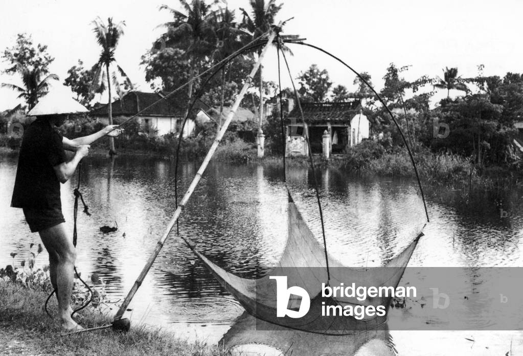 Vietnam: Local fisherman on the river near Hoi An (1950)