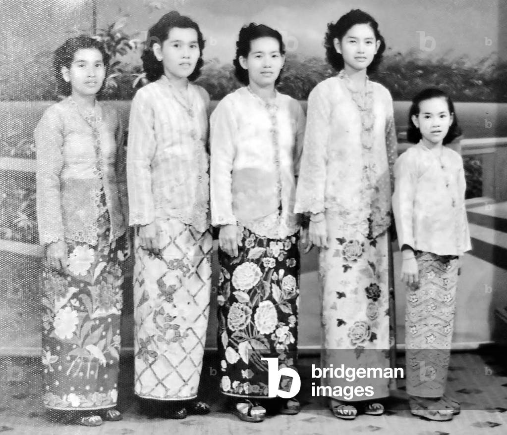 Malaysia / Singapore: Nyonya women wearing sarong kebaya dress typical of the Peranakan Straits Chinese community, c. 1950