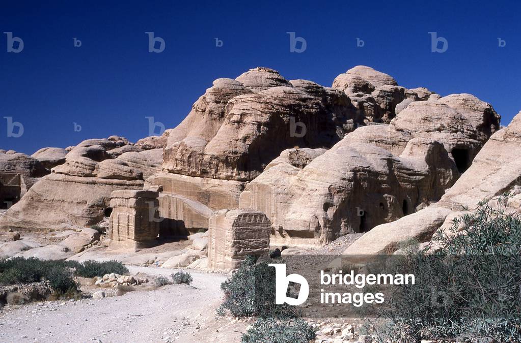 Jordan: The Djinn Blocks (actually tombs) in the Siq (shaft), Petra
