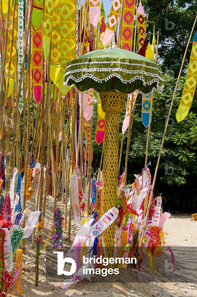 Thailand: Astrological banners adorn the giant songkran sand chedi at Wat Chetlin, Chiang Mai.