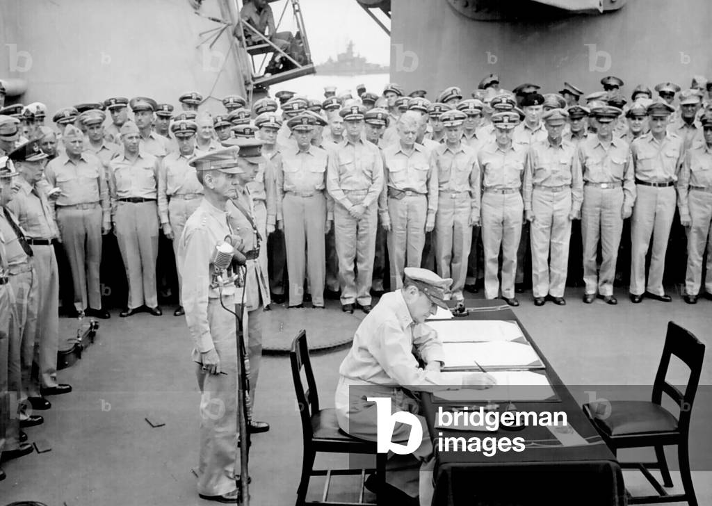 USA / Japan: General Douglas MacArthur signs the Japanese Instrument of Surrender, USS Missouri, Tokyo Bay, September 2, 1945