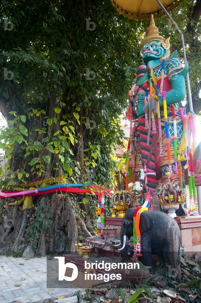 Thailand: A yaksa guards a bo tree shrine, Wat Si Lom, Lampang, Lampang Province