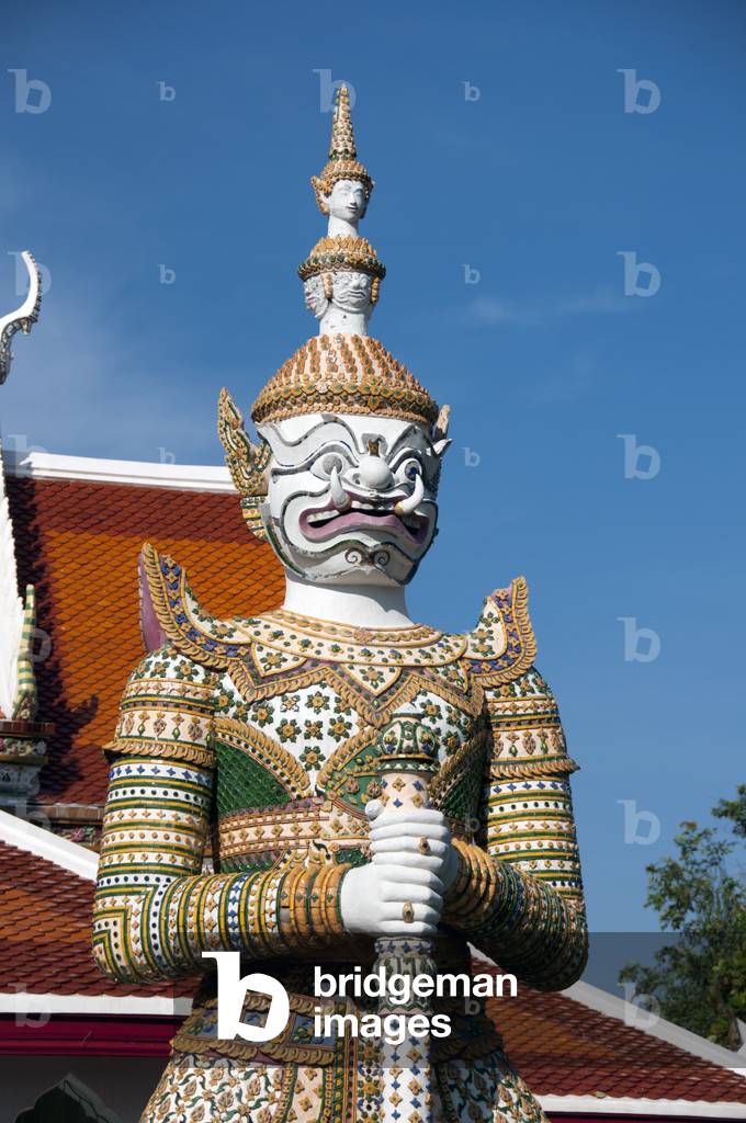 Thailand: Guardian figure or Yaksa at the gateway to Wat Arun (Temple of Dawn), Bangkok