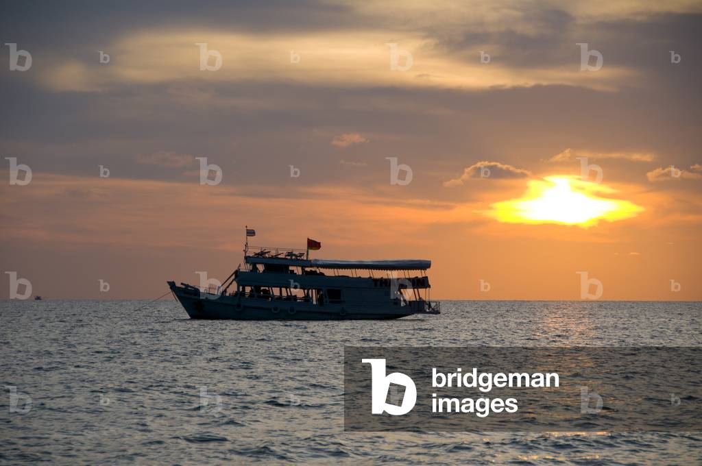 Thailand: A dive boat anchored at sunset near Sai Khao Beach ( Hat Sai Khao), Ko Chang, Trat Province