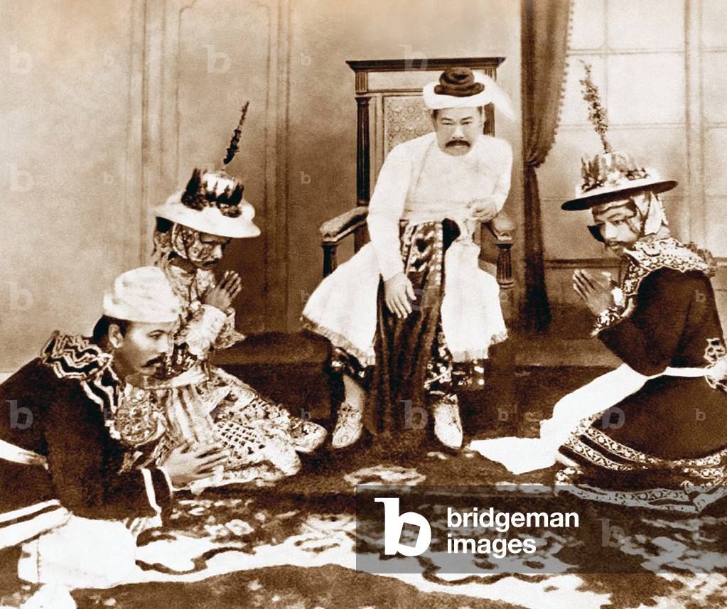 Burma / Myanmar / India: King Thibaw of Burma (1859-1916) in exile, with court officials at his daughters' earboring ceremony, Ratnagiri, 1914