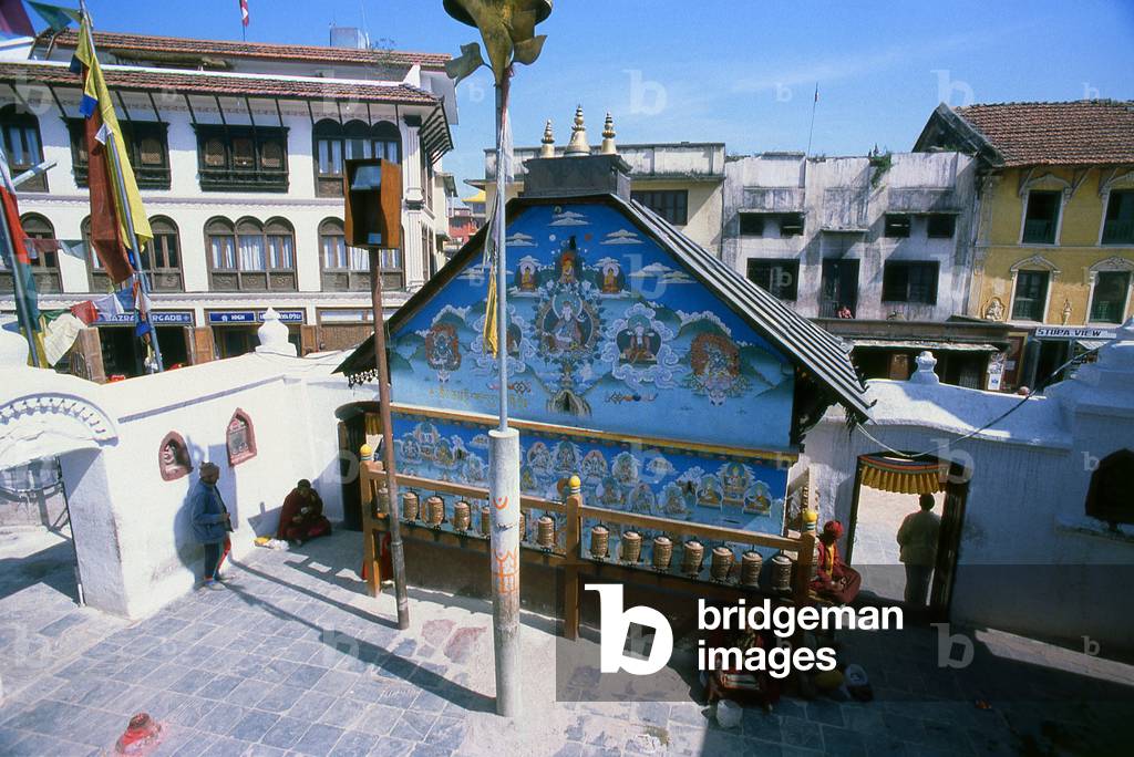 Nepal: An entrance to the giant stupa with prayer wheels in the courtyard, Bodhnath (Boudhanath), Kathmandu