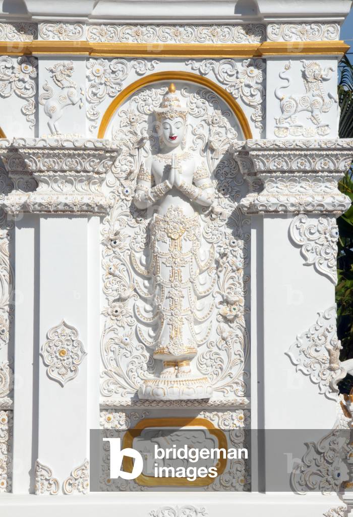 Thailand: Sculpture of a thewada (angel) on the Ho Trai or library building, Wat Changkam, Wiang Kum Kam, Chiang Mai