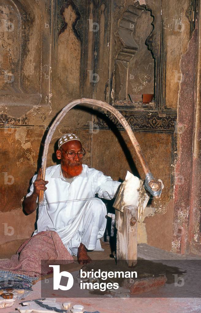 India: A marble craftsman at the tomb of I'timad-ud-Daulah, Agra