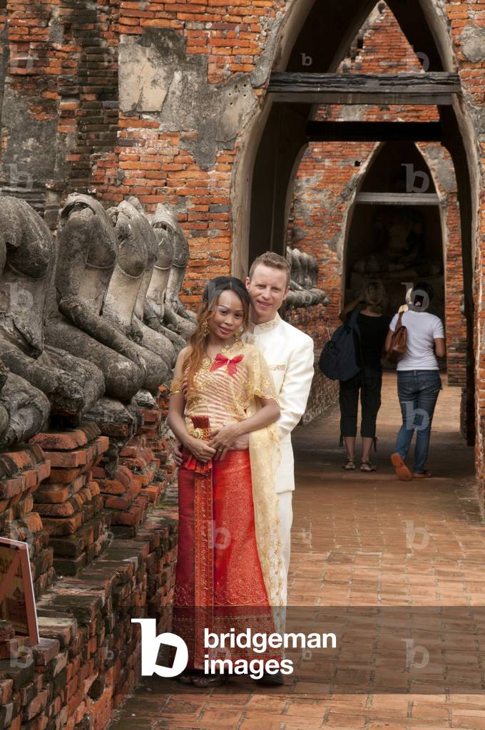 Thailand: A young couple posing for their wedding photos, Wat Chai Wattanaram, Ayutthaya Historical Park
