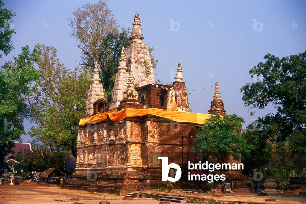 Thailand: Stucco thewada (angels) adorn the Maha Chedi (Great Chedi), Wat Chet Yot (Seven Spires), Chiang Mai, northern Thailand