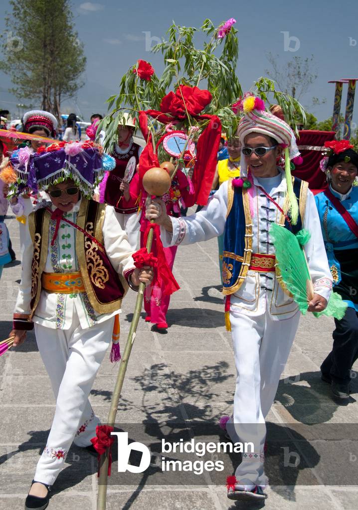 China: A Bai couple dance at the Bai music and dance festival at Santa Si (Three Pagodas), Dali, Yunnan