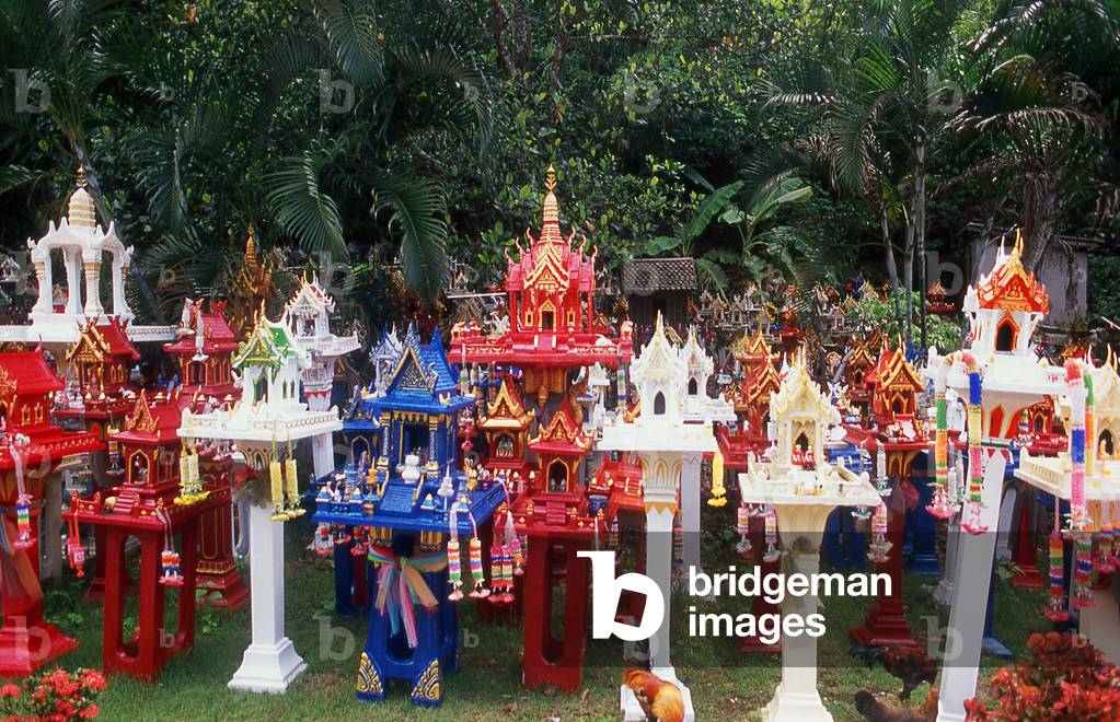 Thailand: Spirit houses line the road on the border between Chiang Mai and Lampang provinces, set up here to protect motorists on a dangerous stretch of road