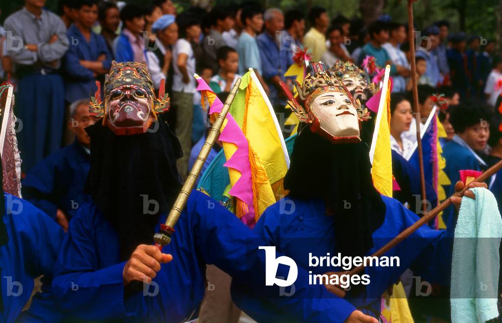 China: Miao mask performance at a festival near Huangguoshu, Guizhou Province