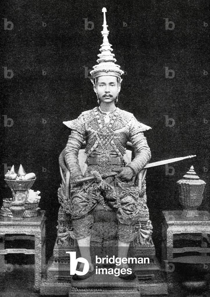 Thailand: King Chulalongkorn sits on his throne dressed in his coronation robes, Siam, c. 1880.