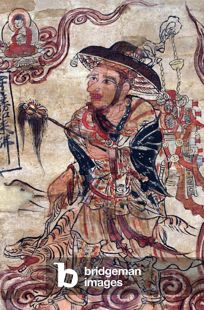 China: An itinerant monk carrying manuscripts, possibly a representation of Xuanzang (Hsuan-tsang, c. 602 - 664), Mogao Caves, Dunhuang, Gansu Province, 8th-9th century CE (see also CPA0010877)