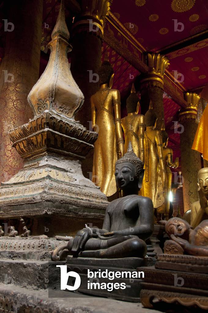Laos: A small Buddha image behind the main Buddha image in the sim (ordination hall), Wat Mai Suwannaphumaham, Luang Prabang