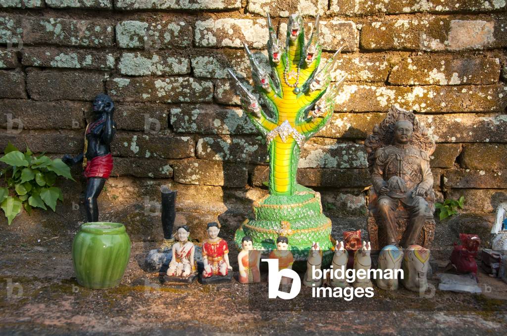 Thailand: A selection of statues including Thai King Chulalongkorn (Rama V) placed at the base of Chedi Plong by devotees, Wat Chiang Chom (Wat Chedi Plong), Chiang Mai