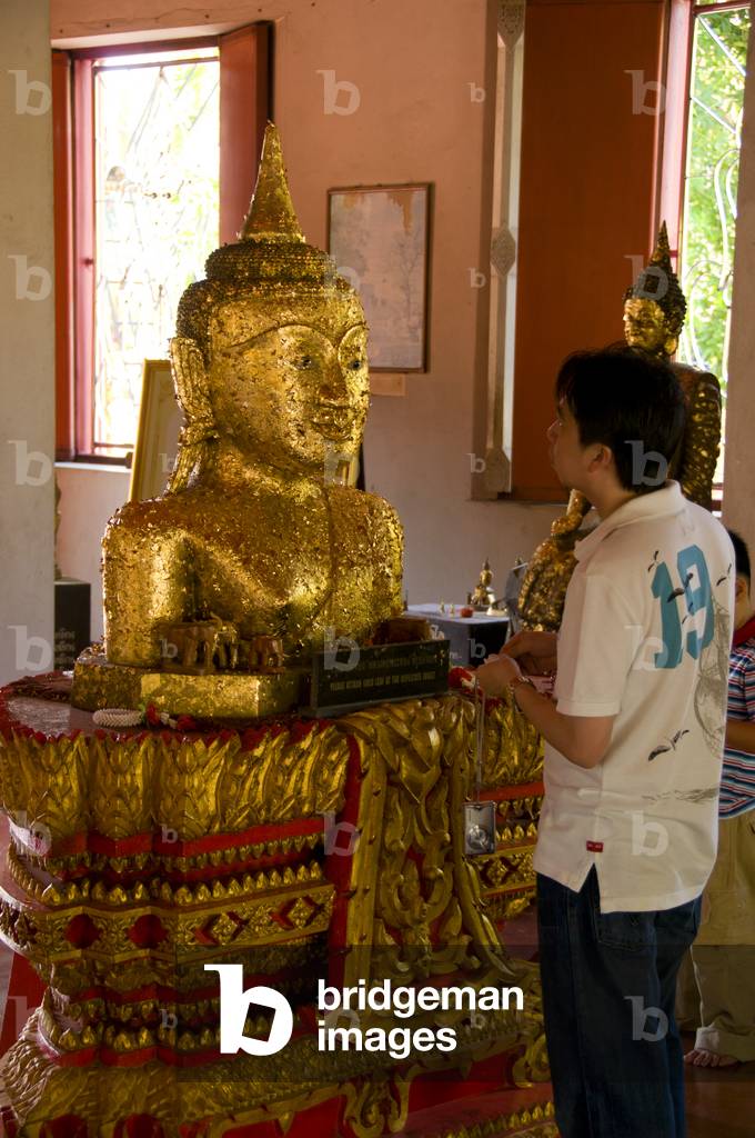 Thailand: A copy of the Phra Thong temple's famous half buried Buddha figure for people to press gold leaf onto, Wat Phra Thong, Phuket