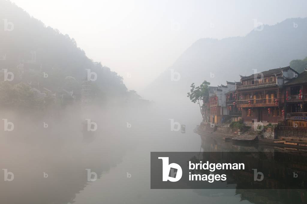 China: Early morning on Fenghuang's misty Tuo River, Fenghuang, Hunan Province