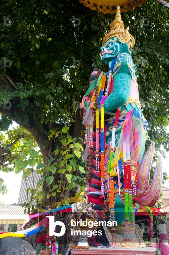 Thailand: A yaksa guards a bo tree shrine, Wat Si Lom, Lampang, Lampang Province