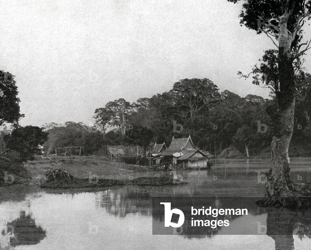 Thailand: A Siamese hamlet on a canal near the Chao Phraya River, north of Bangkok, c. 1900.