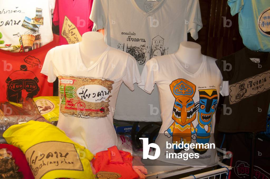 Thailand: Locally made T-shirts including one with Phi Ta Khon masks for sale on Chai Kong Road, Chiang Khan, Loei Province